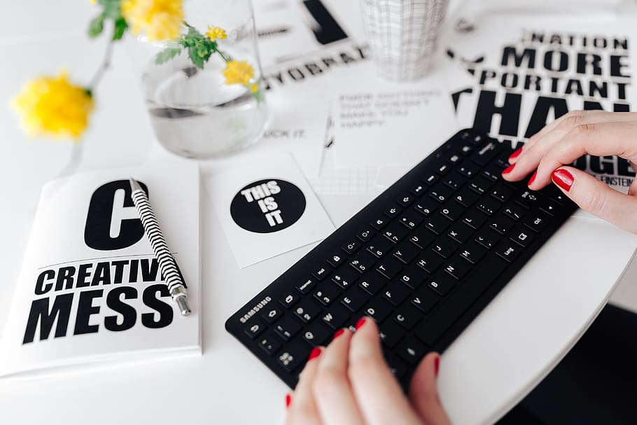 Female hands typing on the remote wireless computer keyboard HD wallpaper