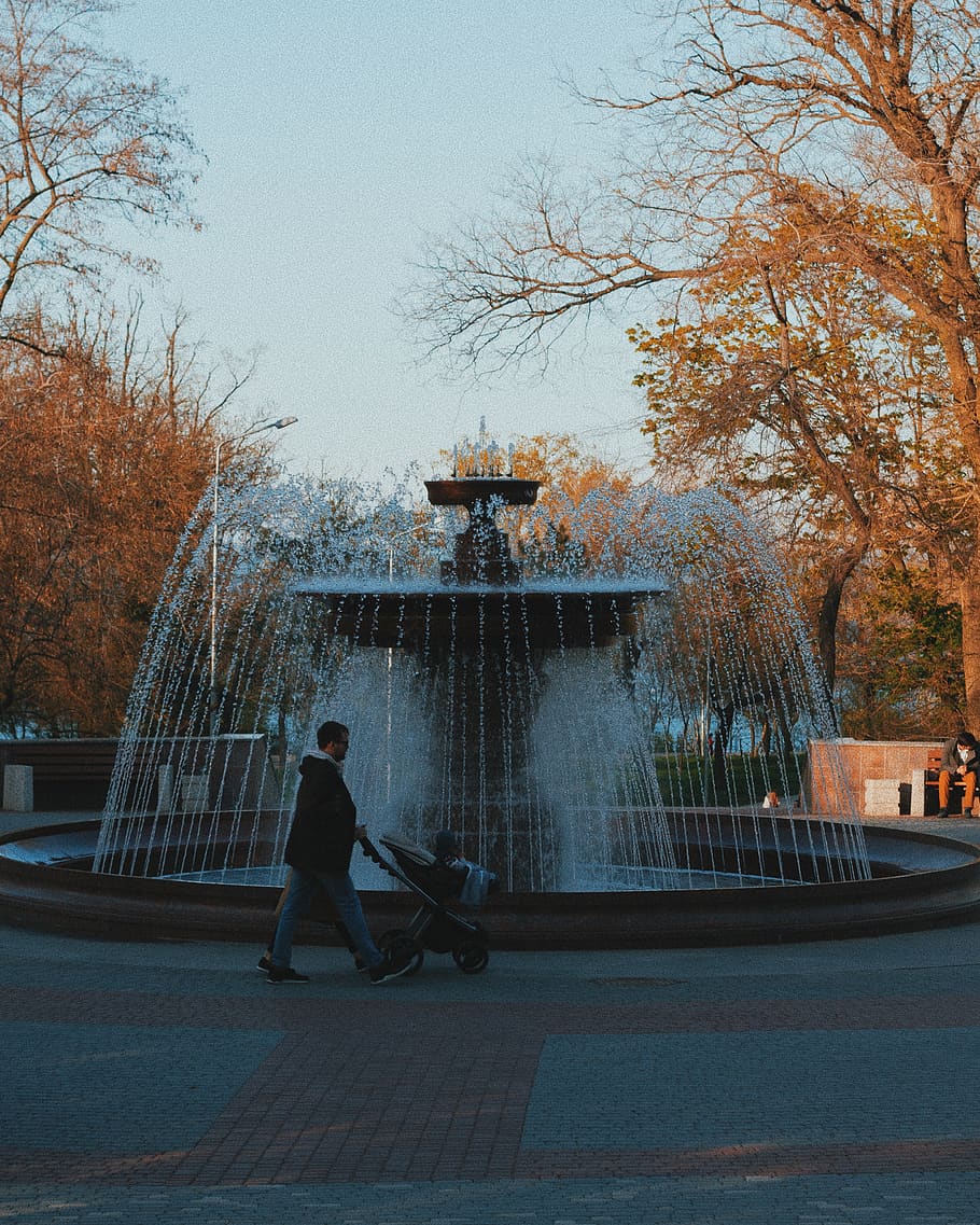 man holding stroller, water, person, human, fountain, machine HD wallpaper