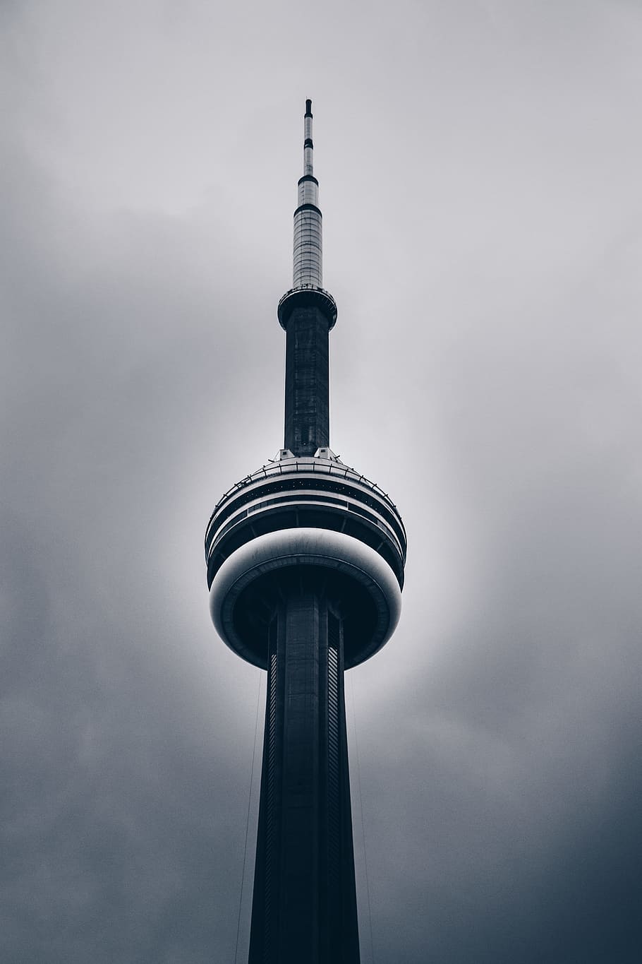 low-angle photo of CN tower, building, cloudy, grey, dark, storm