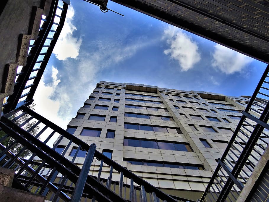 Low-angle Photography of High Rise Building Under Stratus Clouds HD wallpaper