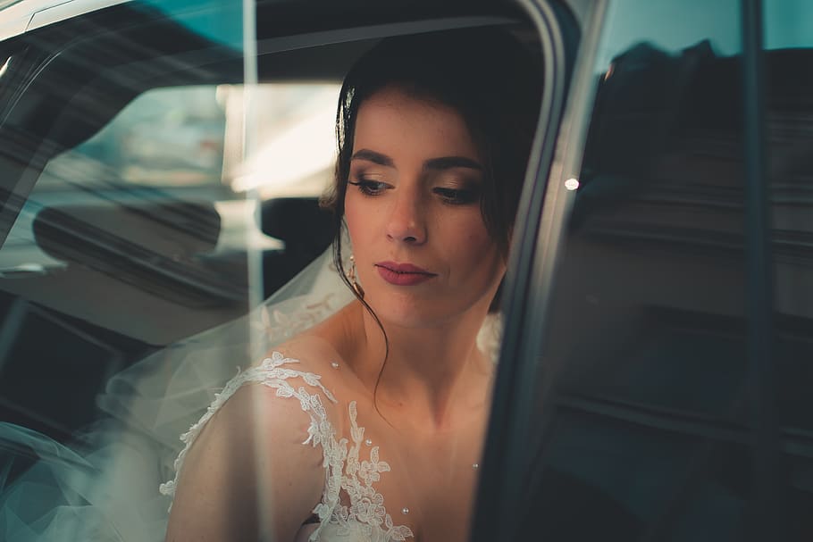 woman wearing veil looking outside window, wedding, bride, wedding dress