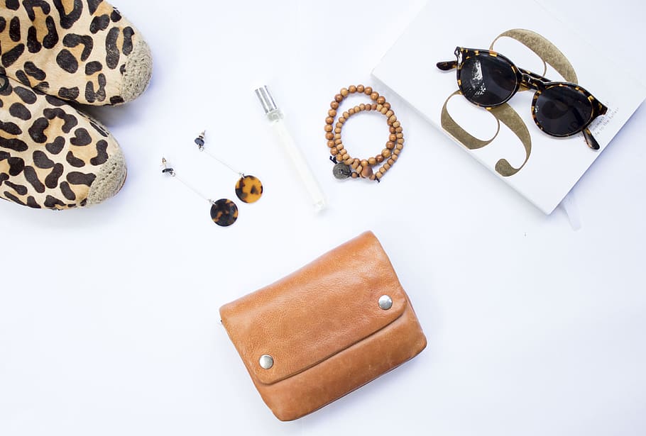 tortoiseshell Clubmaster-style sunglasses near beaded brown necklace HD wallpaper