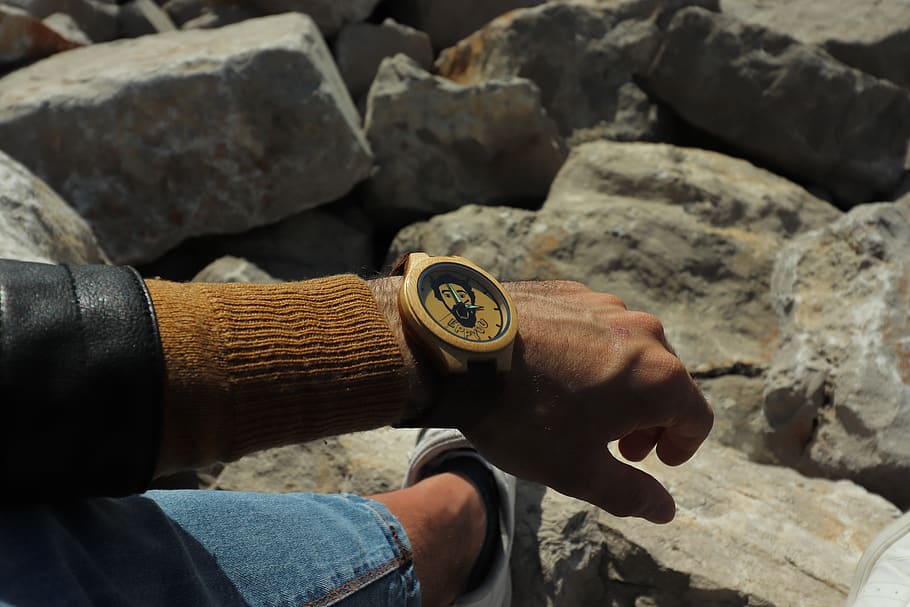 round brown and black analog watch, human, person, rock, wristwatch, HD wallpaper