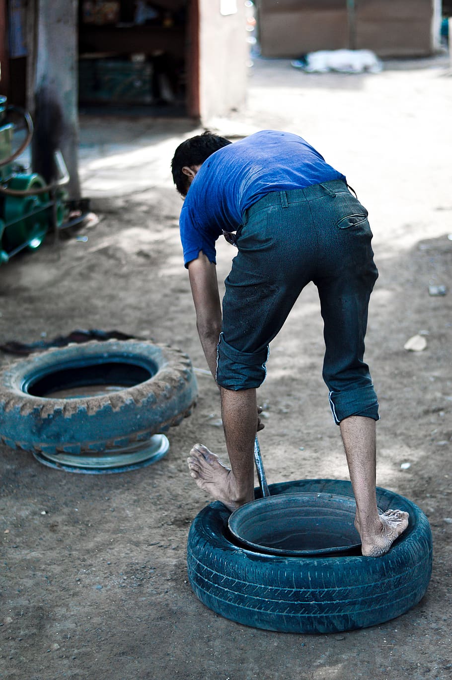 man changing tire during daytime, person, human, water, transportation HD wallpaper