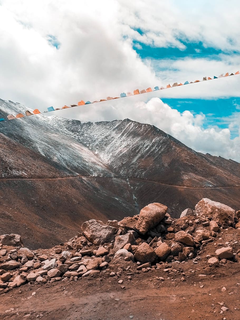 Multicolored Banners on Rocky Formation, altitude, clouds, cloudy HD wallpaper