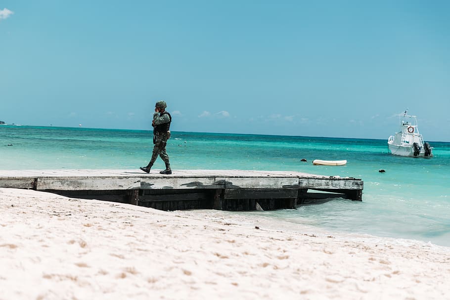 army man walking on dock, water, person, human, waterfront, vehicle HD wallpaper