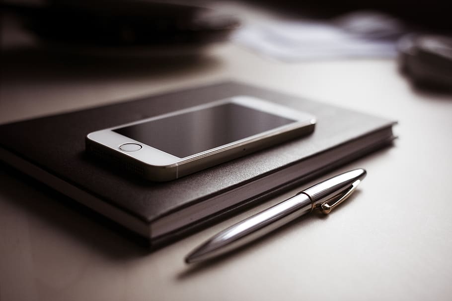 Silver Iphone 6, apple, desk, iphone 5s, notebook, pen, smartphone HD wallpaper