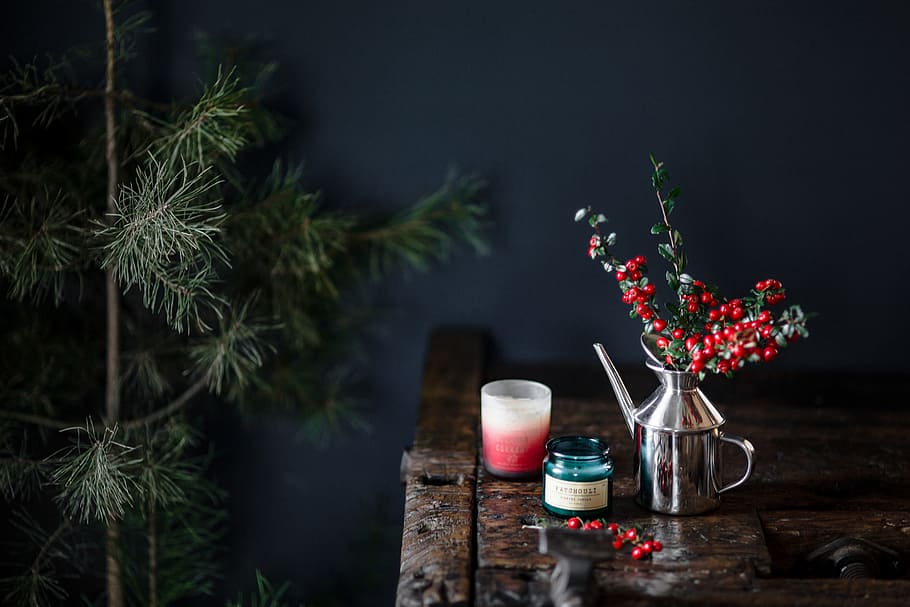 Fresh Holly and Candles, wooden desk, old wood, fresh coconut