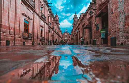 empty alley with buildings on side under blue sky, architecture HD wallpaper