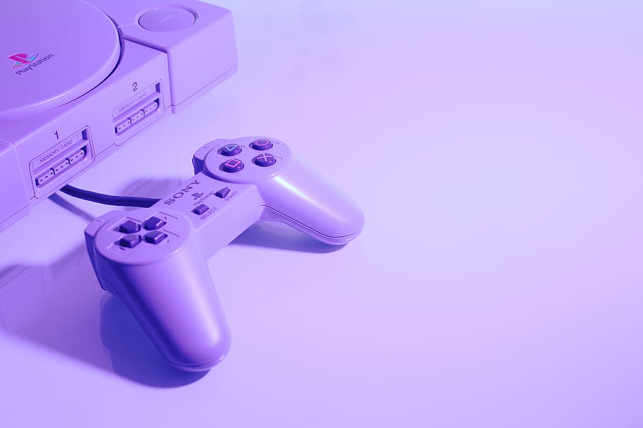 gray Sony PlayStation console with corded controller, pink color HD wallpaper
