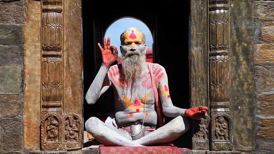 man sitting on brown wall, spirituality, creativity, religion HD wallpaper