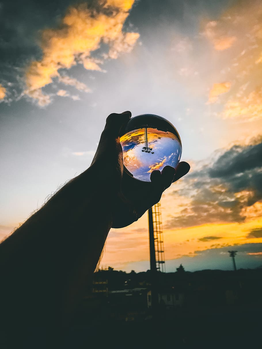Person Holding Glass Ball, backlit, clouds, dawn, daylight, energy HD wallpaper