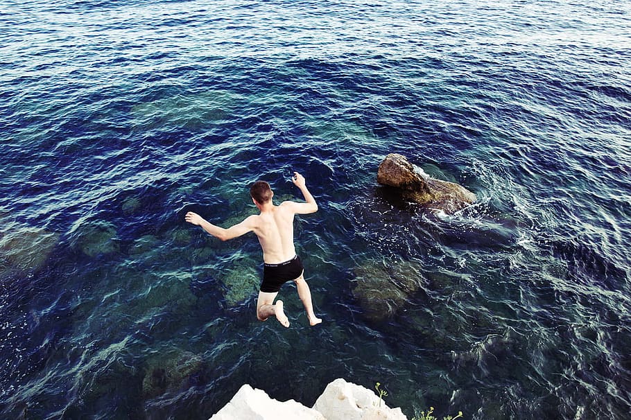 jump, jumping, man, sea, water, river, lake, rock, rocky, leisure activity HD wallpaper