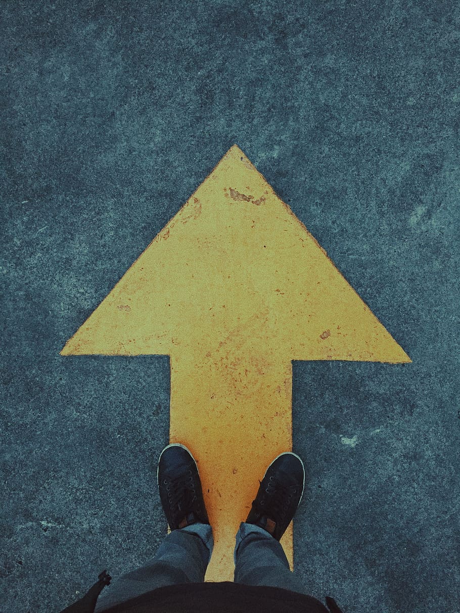 person standing on yellow arrow, foot, direction, journey, street HD wallpaper