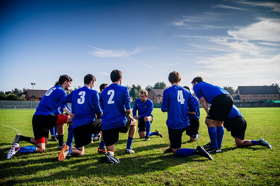 Group of Sports Player Kneeling on Field, action, activity, adult