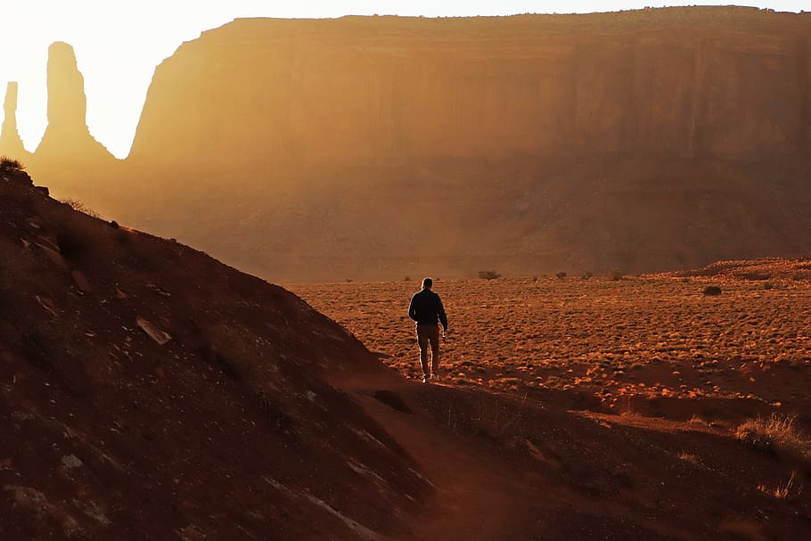 man walking near brown cliff, human, person, outdoors, nature, HD wallpaper