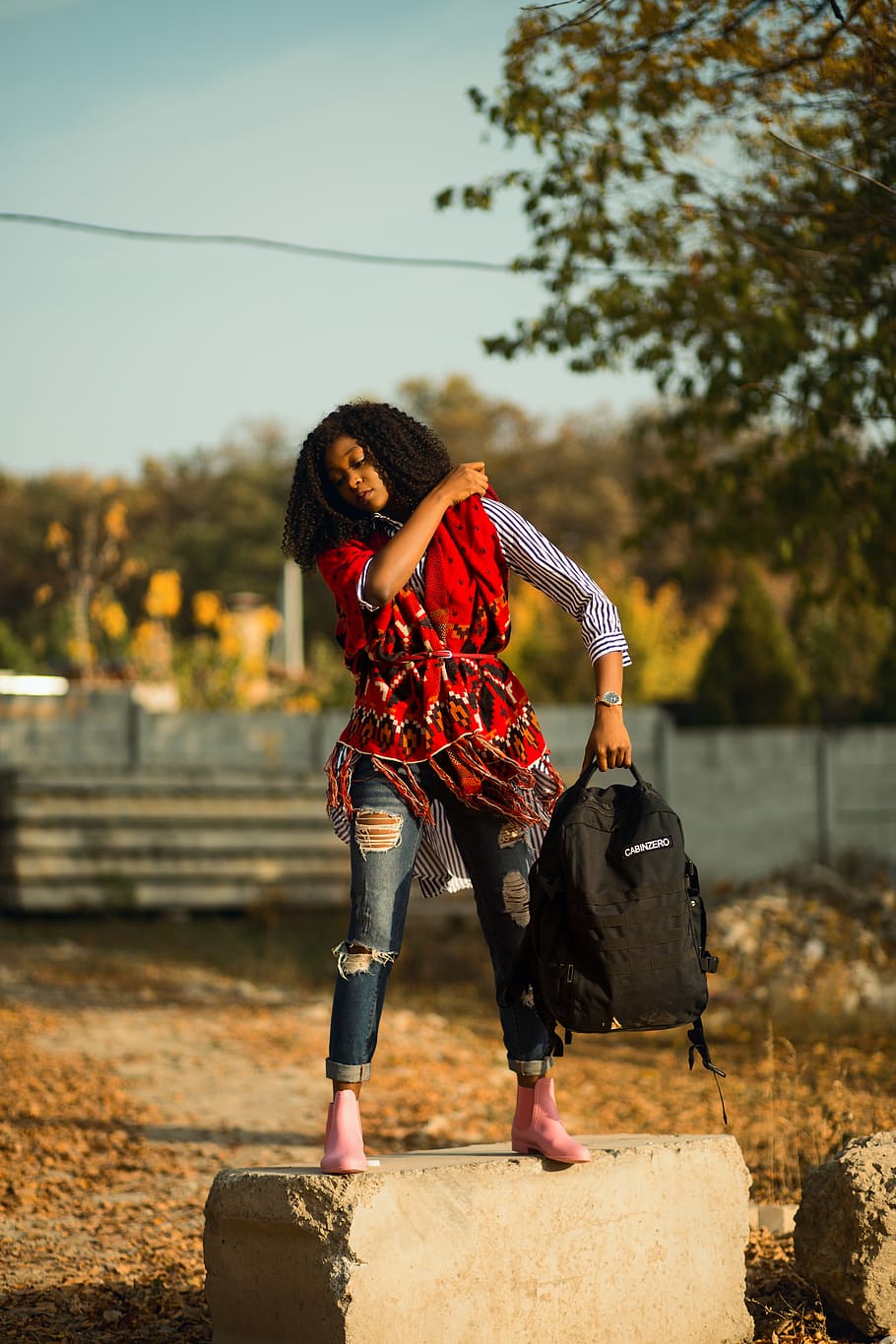 Woman Holding Her Backpack, blur, boots, carrying, curly hair HD wallpaper