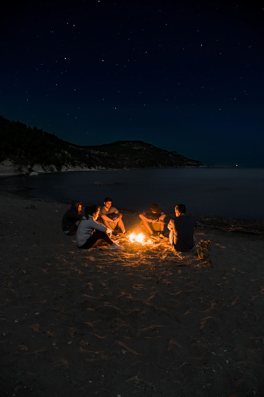 Summer Friends Around a Beach Campfire