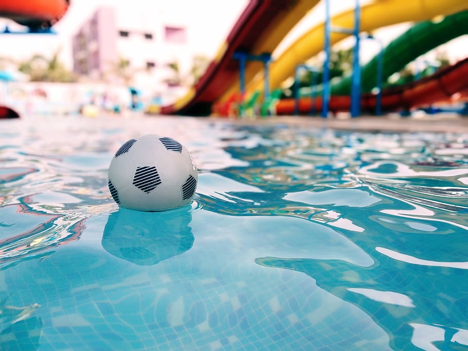 Soccer Ball On Swimming Pool, dug-out pool, slides, water, focus on foreground HD wallpaper
