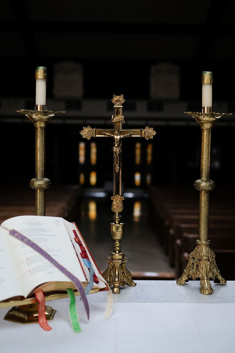 brass cross between candle holders, belief, book, religion, publication HD wallpaper