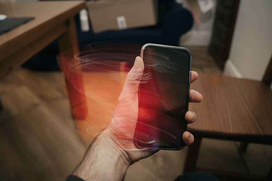 person holding iPhone, human hand, one person, human body part HD wallpaper
