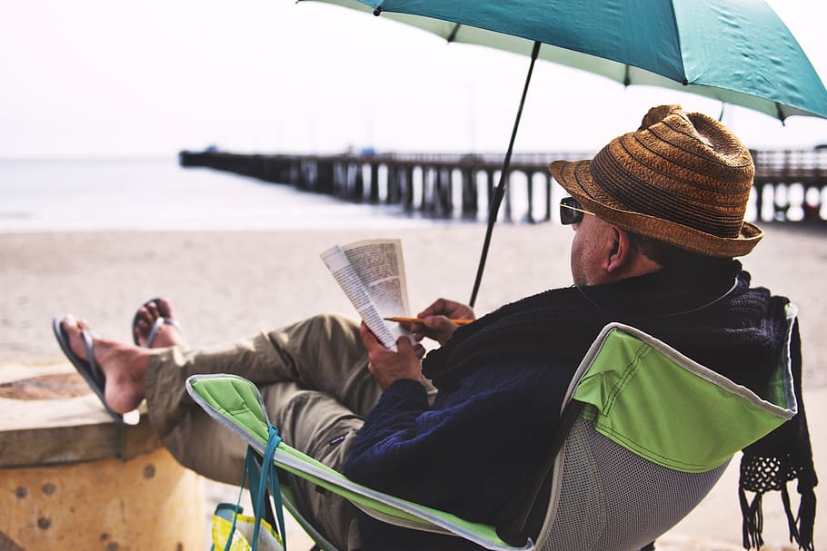 HD wallpaper: Man Sitting on Chair Under Blue Umbrella Near Beach ...