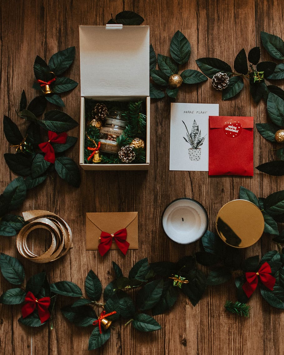 closed envelope beside open box with pine cones, wood - material HD wallpaper