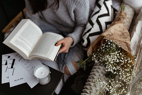 A woman in a sweater reads a book, reading, reader, opened book HD wallpaper