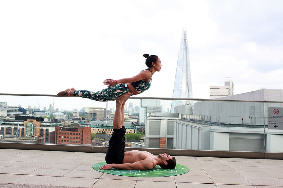 Photo Of Man Lifting Woman Using His Feet, acro yoga, balance, HD wallpaper