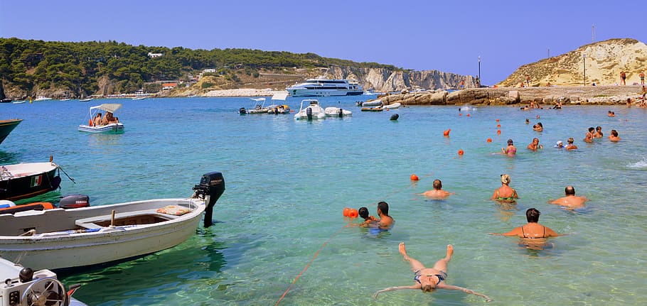 bathers, water, transparent, clear, clean, sea, beach, boats HD wallpaper