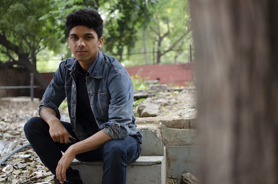 Man in Blue Denim Jacket Sits on Platform Concrete, boy, daylight HD wallpaper
