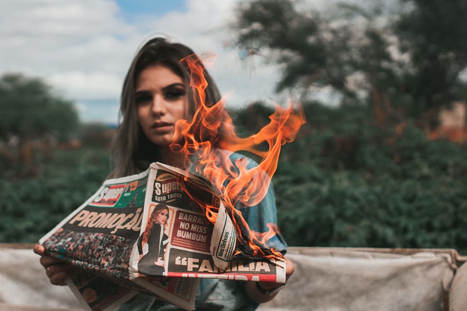 Woman Burning Newspaper, flame, person, one person, front view HD wallpaper