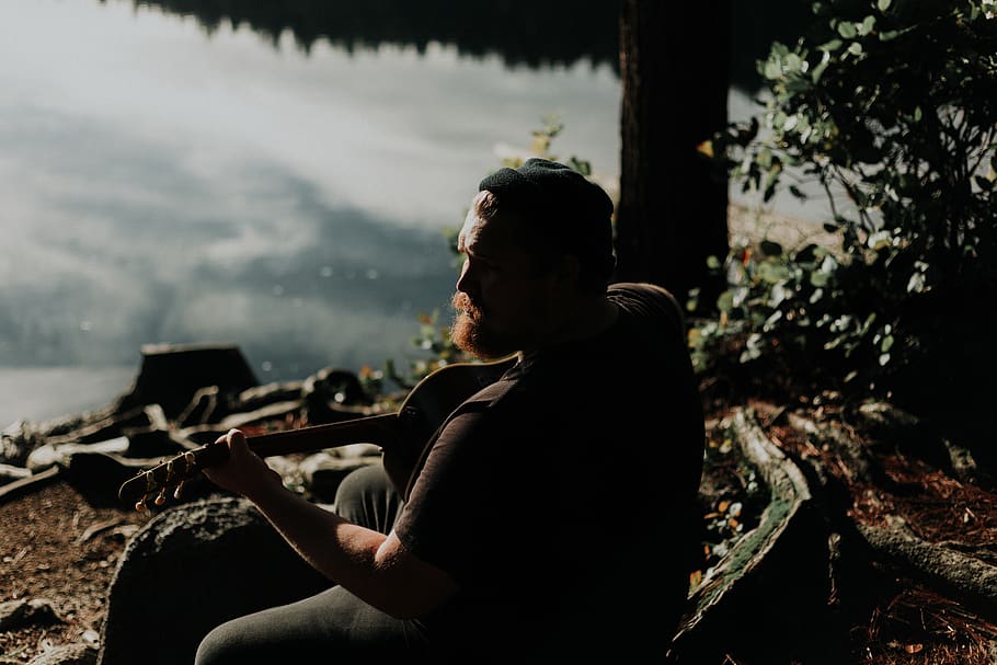 man playing guitar, sitting, one person, real people, lifestyles HD wallpaper