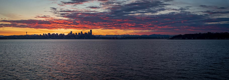 high-rise buildings viewing calm sea during sunset, nature, outdoors, HD wallpaper