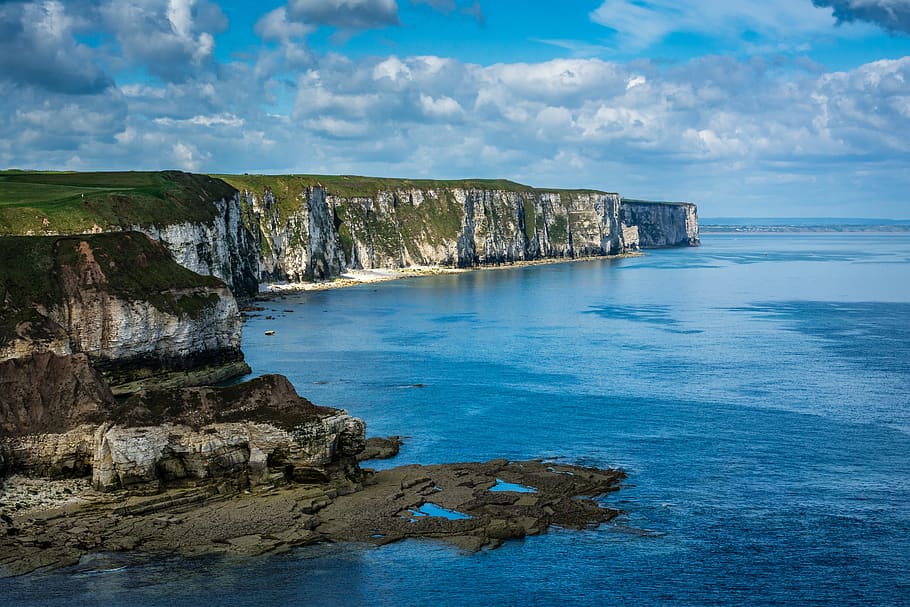 Rock Cliff and Body of Water, cliffs, clouds, cloudy, idyllic HD wallpaper