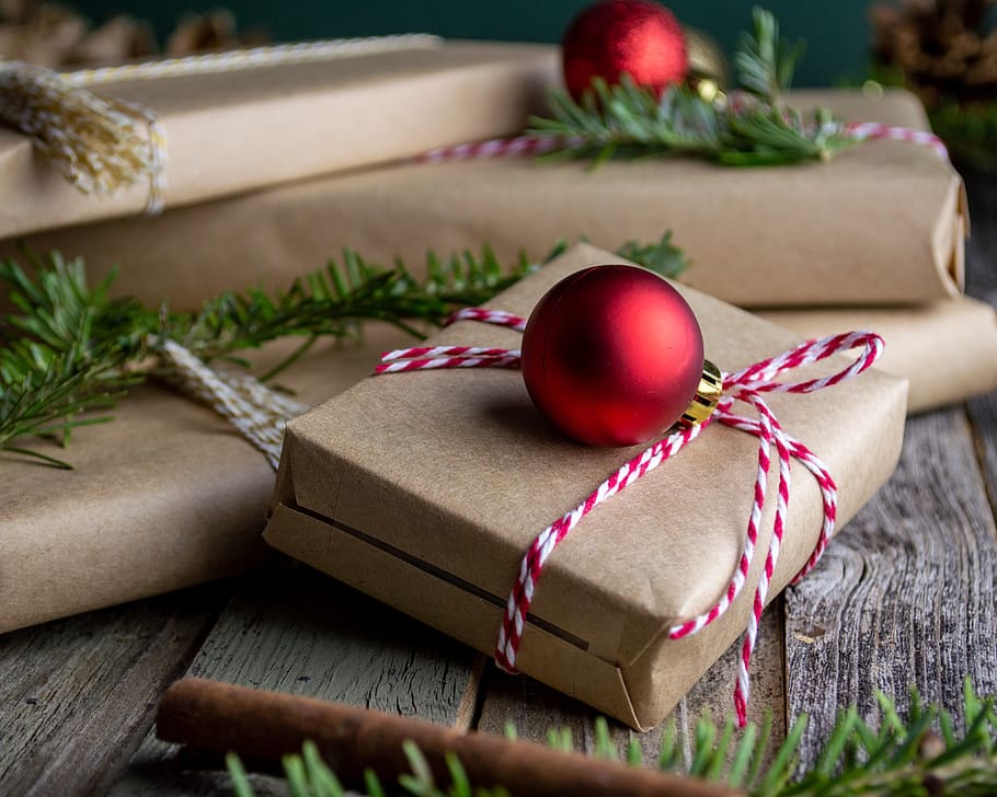 red bauble on brown giftbox, christmas, celebration, christmas decoration HD wallpaper