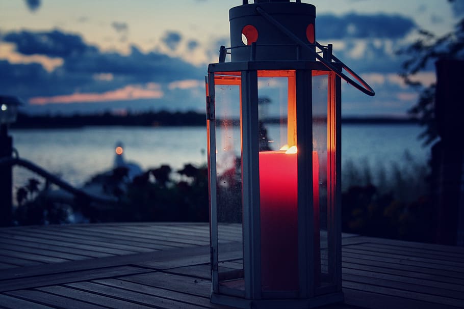 Red Pillar Candle in White Lamp, beach, candlelight, close-up, HD wallpaper