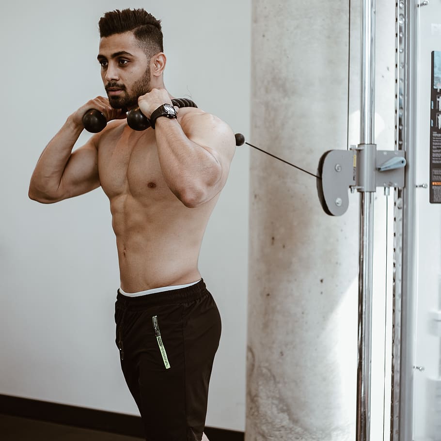 man wearing brown pants doing exercise, muscular build, one person HD wallpaper