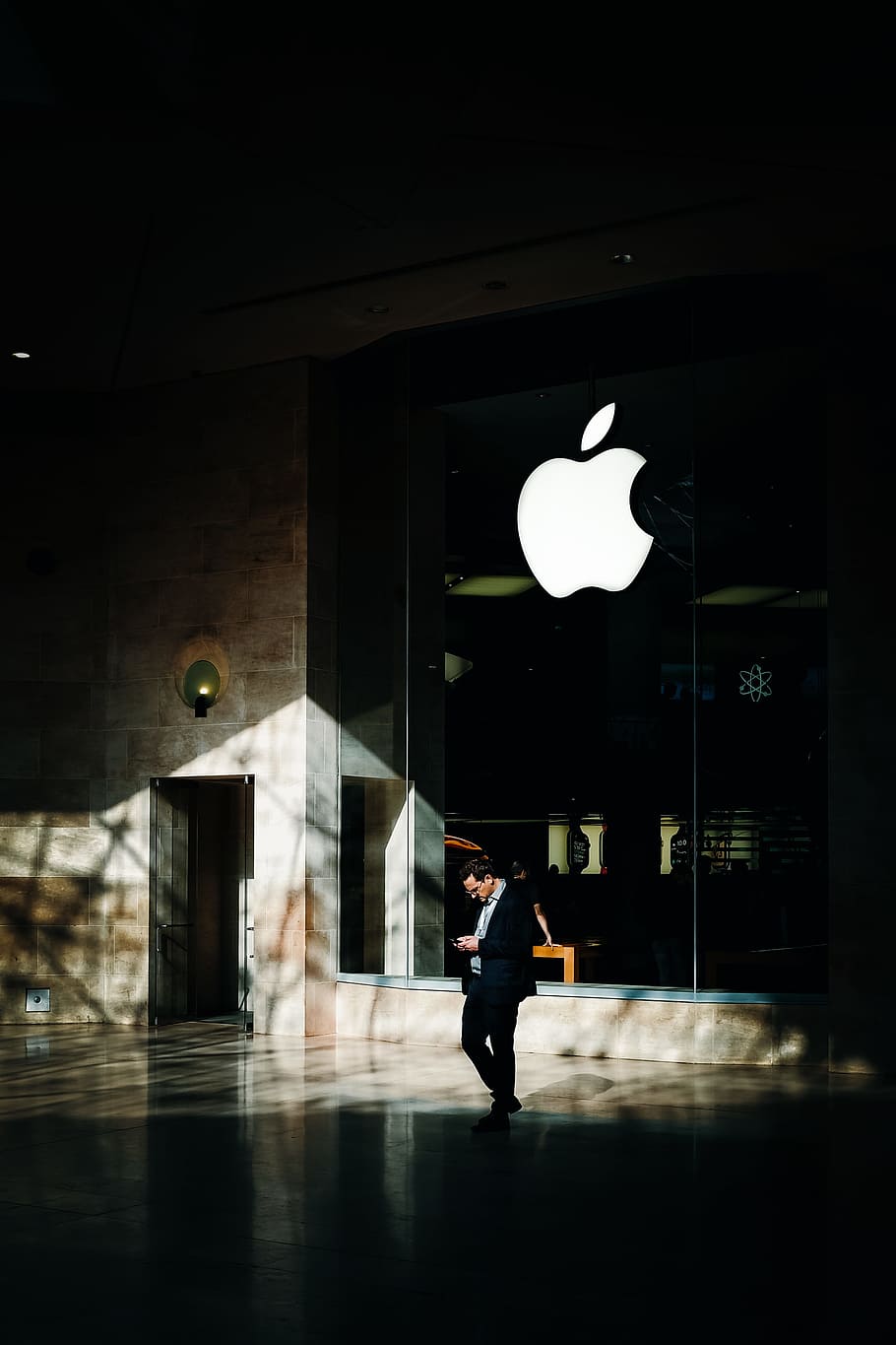 person standing in front of Apple emblem, shadow, light, phone HD wallpaper