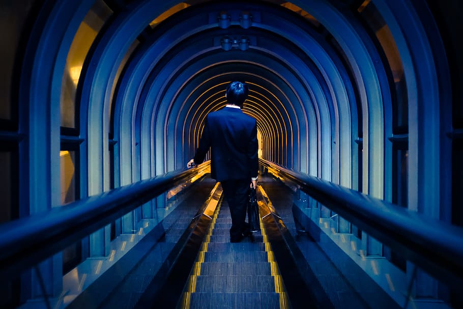 man standing on escalator, blue, contrast, osaka, japan, yellow HD wallpaper