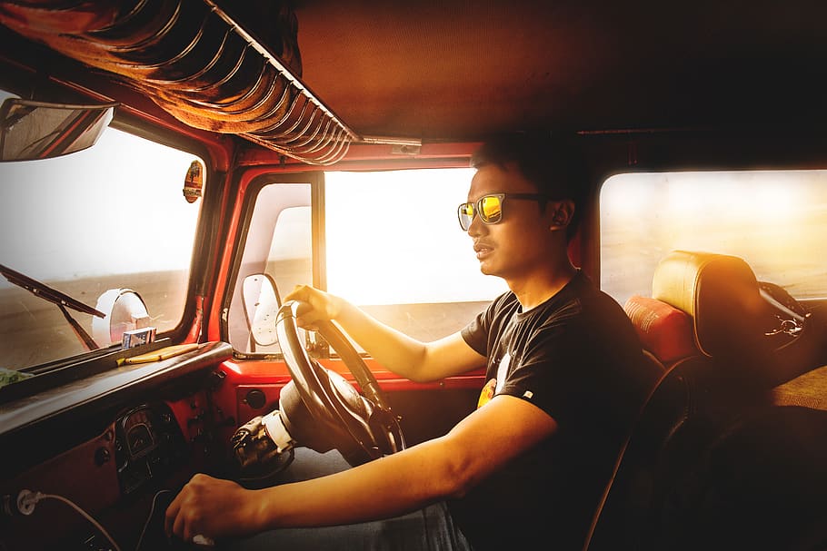 Man Driving Vehicle, automobile, dashboard, drive, driver, golden hour HD wallpaper