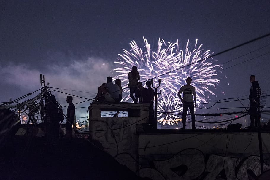 person watching fireworks display, silhouette, celebration, cityscape HD wallpaper