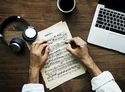 Person Writing on Beige Musical Note Beside Laptop, background HD wallpaper