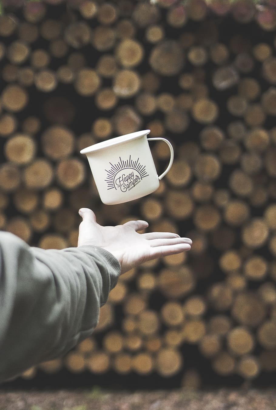 Person Flipping White Mug With Happy Camper Print, blur, close-up HD wallpaper