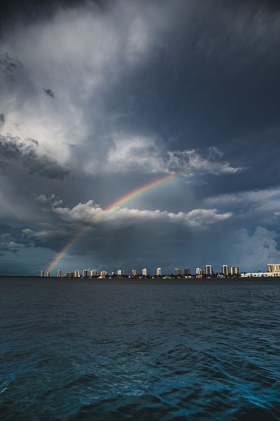 rainbow over cityscape during daytime, nature, outdoors, sky HD wallpaper
