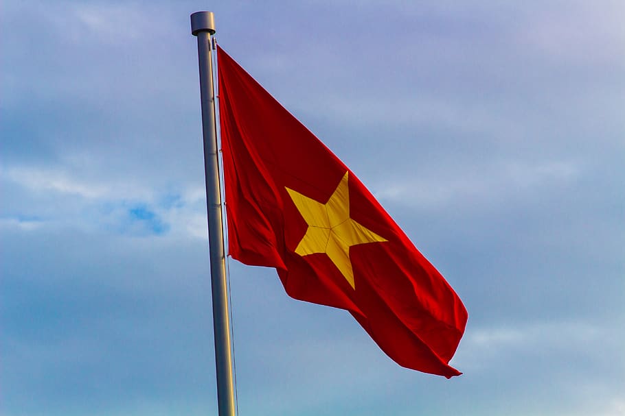 red and yellow flag with star on pole, symbol, vietnam, hanoi