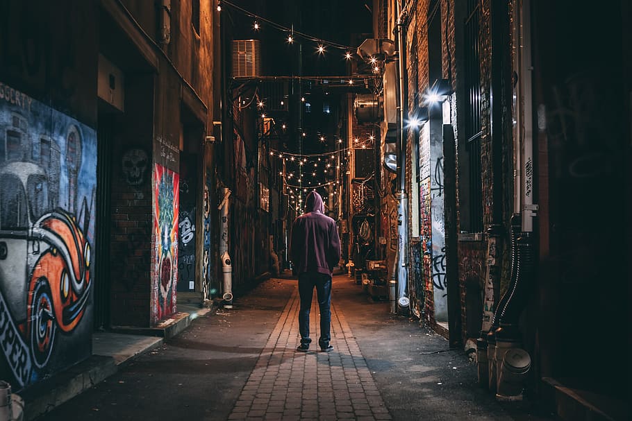 Man Standing on Brown Pathway, adult, alley, architecture, city