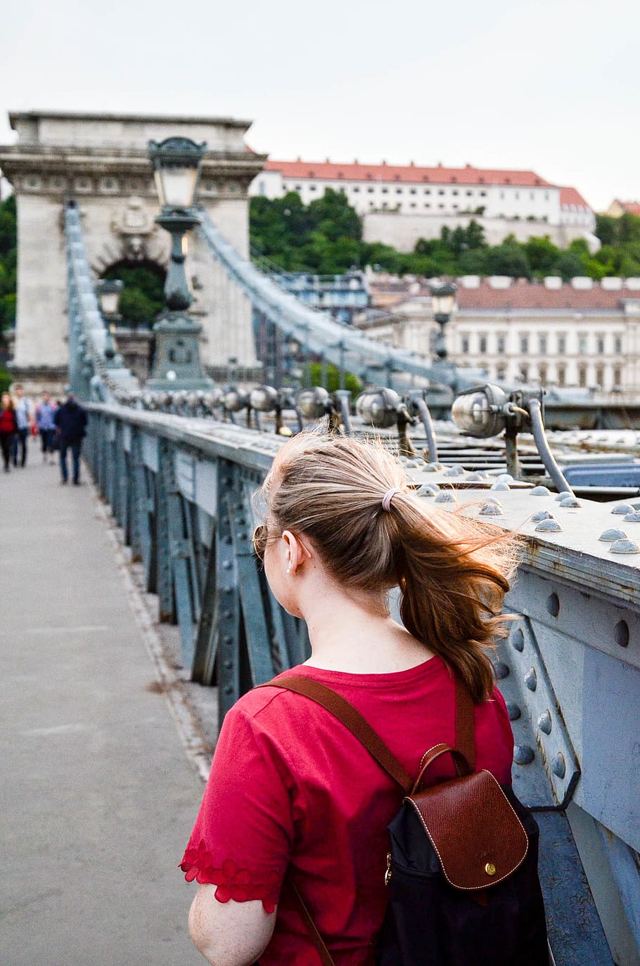 Woman Wearing Brown Leather Backpack Standing on Bridge Photo Taken HD wallpaper