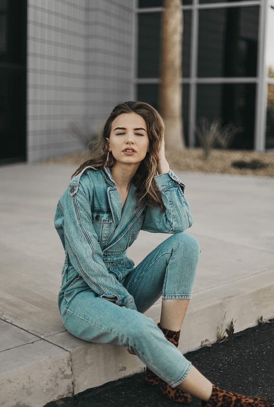 woman in blue denim onesies sitting on the pavement, one person, HD wallpaper