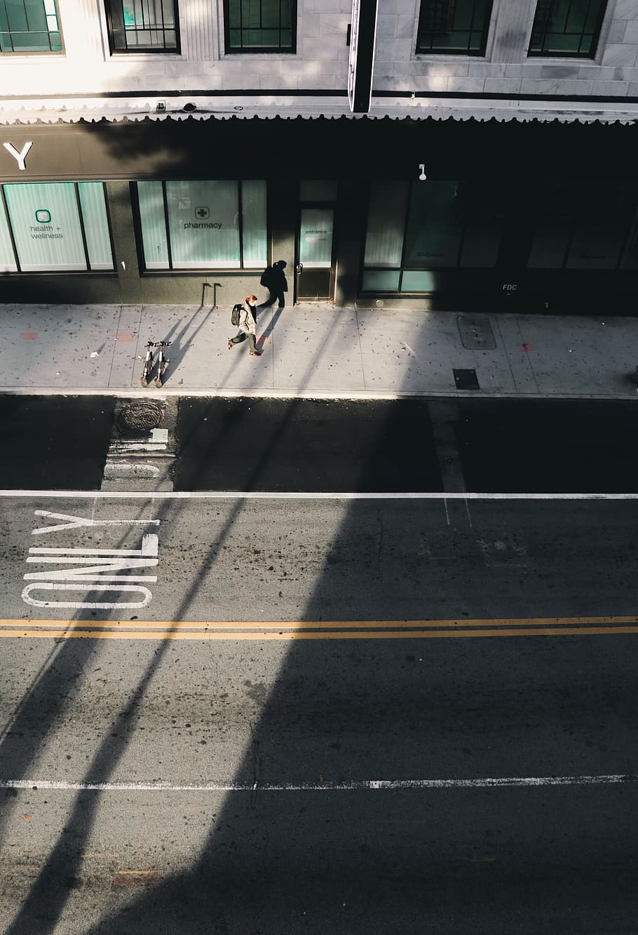 man walking on sidewalk, asphalt, tarmac, road, human, person HD wallpaper